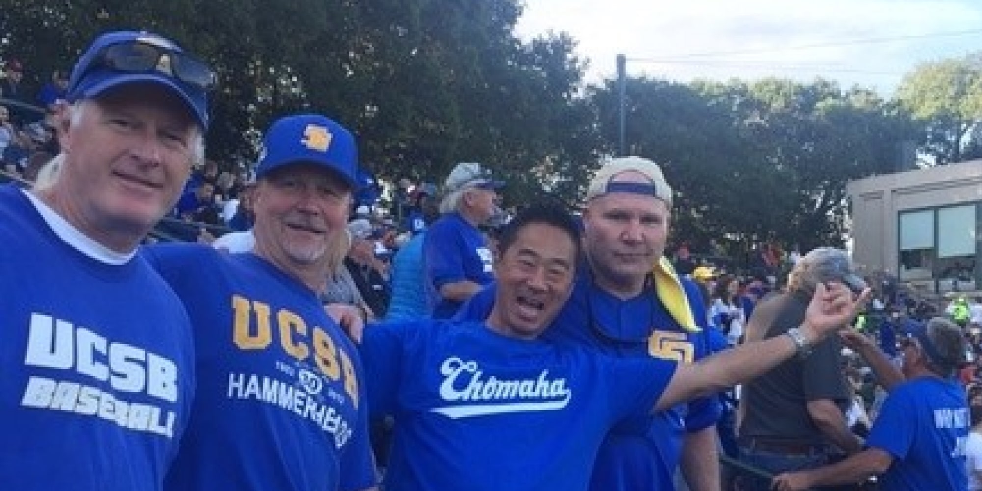 Four fans posing for photo wearing UCSB Baseball shirts