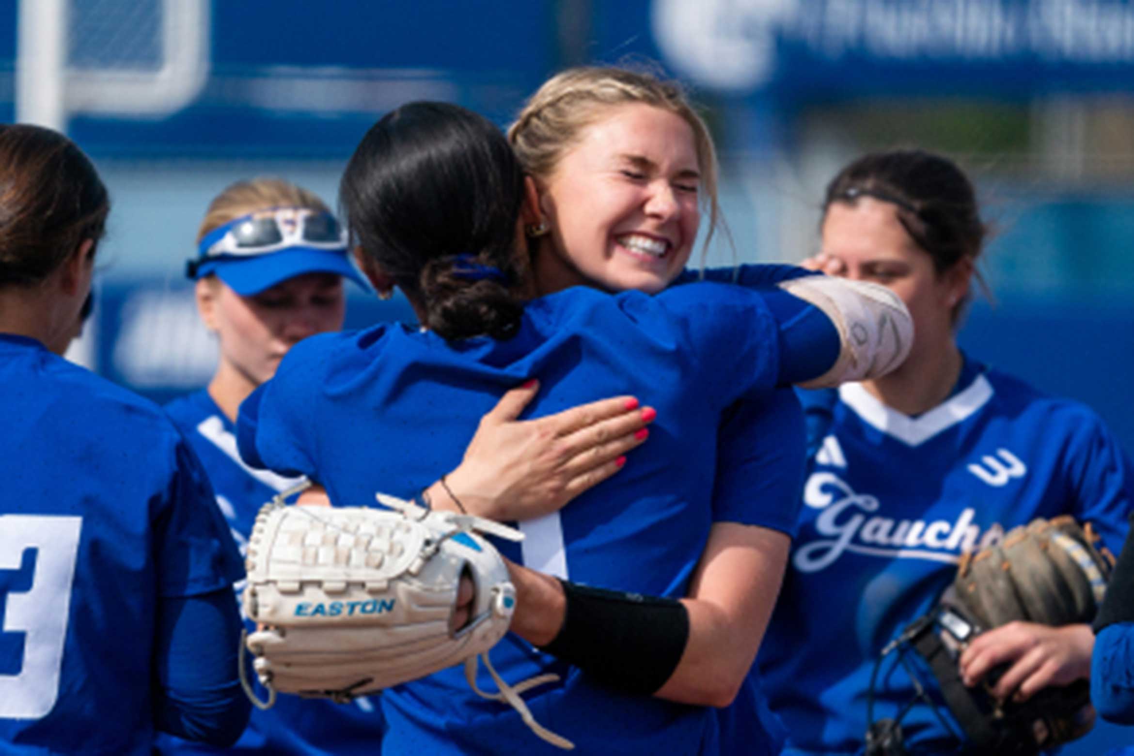 UCSB's women's baseball players celebrating.