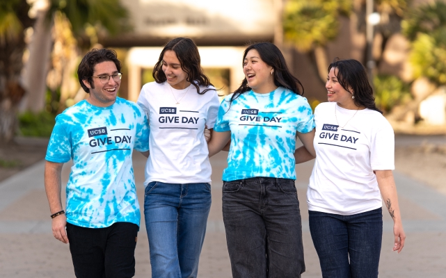 4 UCSB students posing in their Give Day shirt