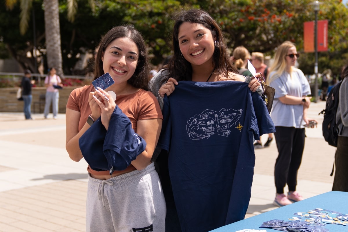 Two students posing on Give Day