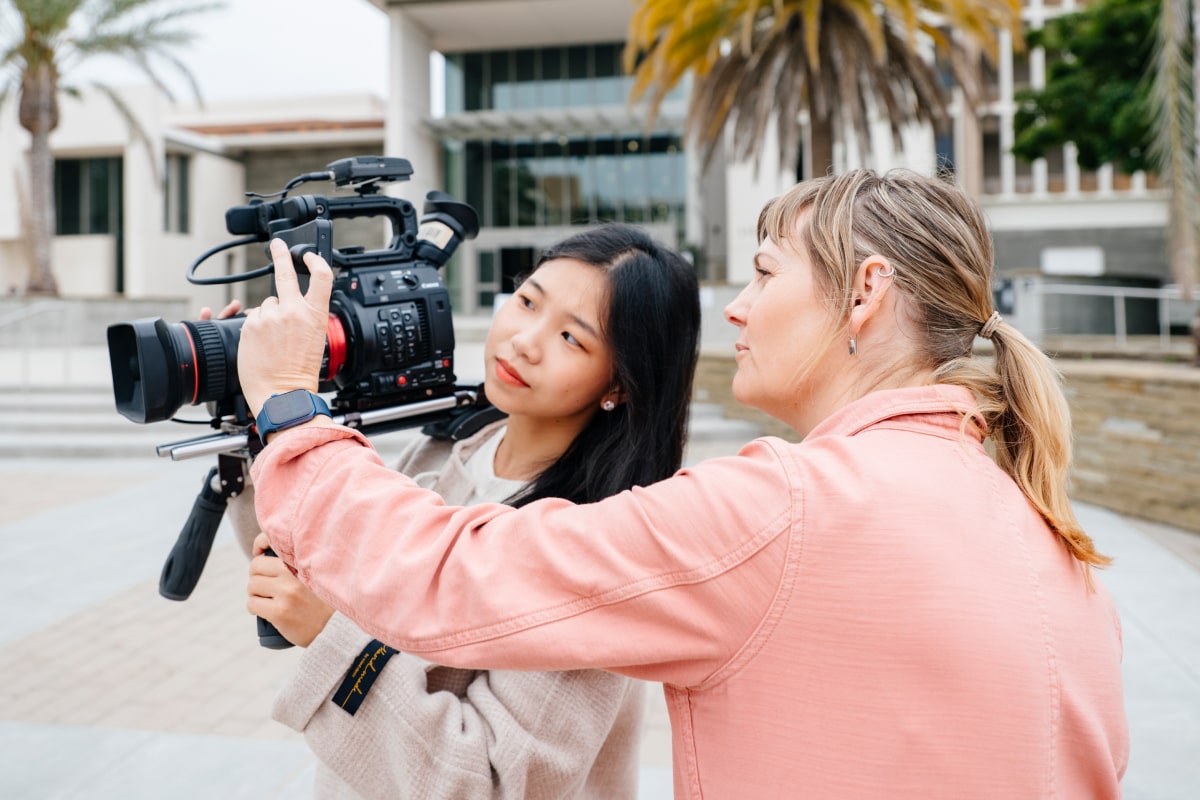 Two women with camera