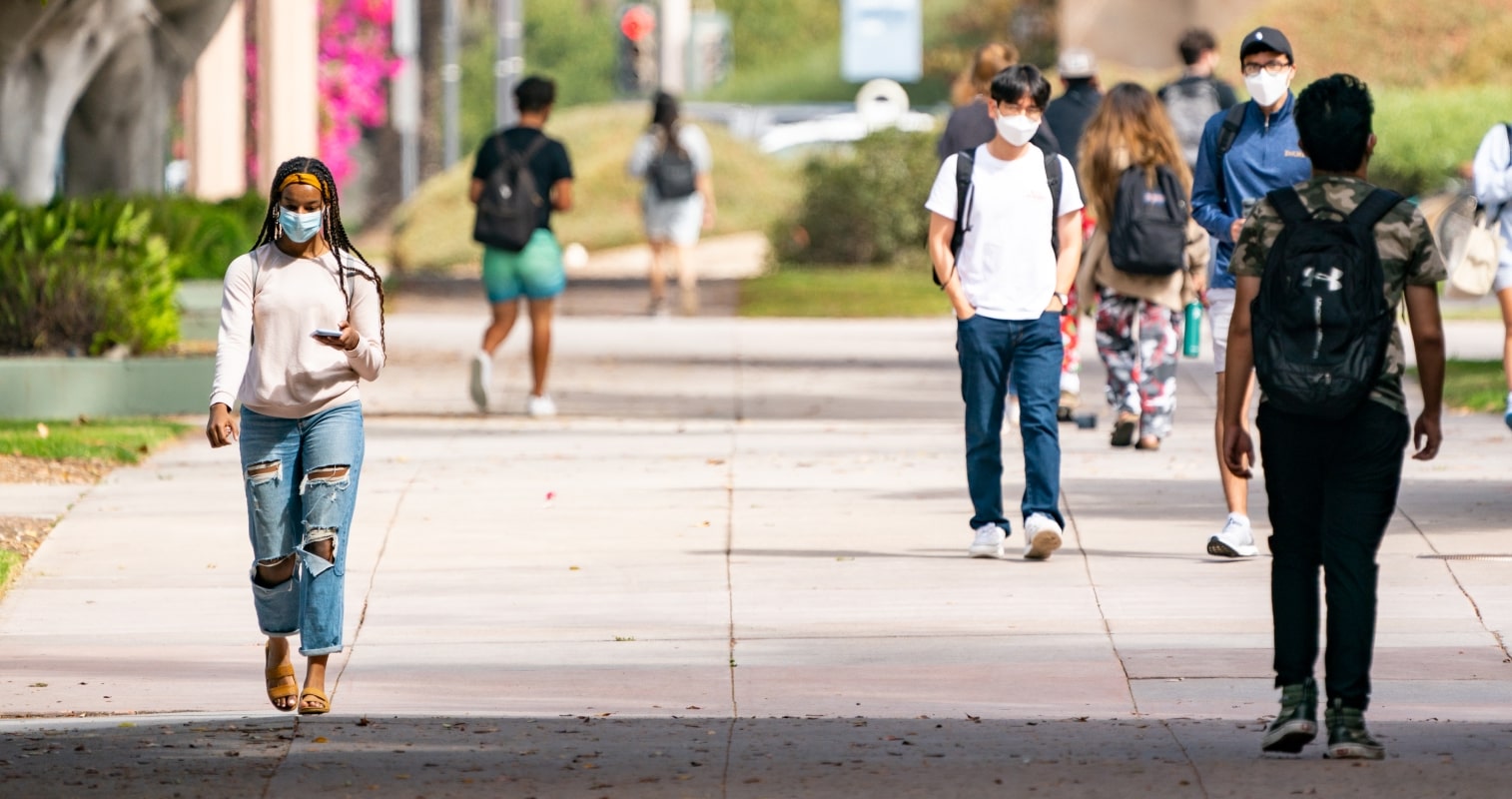 Students with masks walking